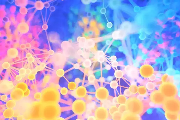 Abstract network of interconnected yellow, pink, and blue spheres against a vibrant, blurred background.